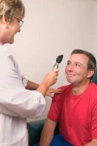 Doctor providing health check on Perth adult patient for preventative health checks